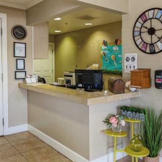 A welcoming reception area with modern decor and a front desk.