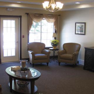 A cozy waiting room with comfortable chairs and a welcoming atmosphere.