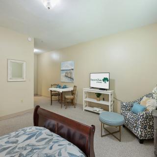 An inviting living space featuring a cozy seating area and small dining setup.
