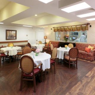 A welcoming dining space with elegantly set tables and comfortable seating.