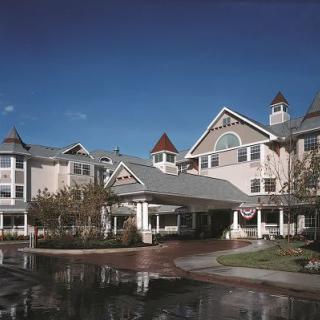 A picturesque resort with classic architectural features under a clear blue sky.