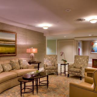 A modern living room with comfortable seating, elegant lighting, and stylish decor.