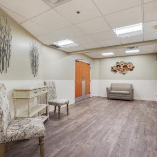 A modern waiting area featuring stylish furniture and a calm color palette.