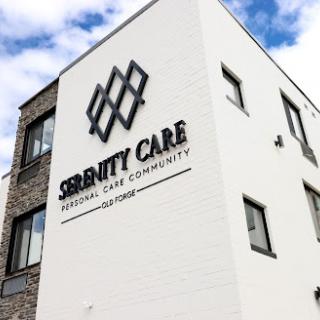 The exterior of the Serenity Care facility, showcasing its modern design and branding.