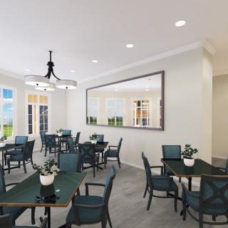 A modern dining room with neatly arranged tables and chairs, complemented by decorative plants and a large wall mirror.