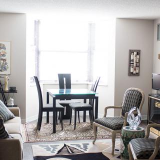 A modern living and dining area with stylish furniture and decor.