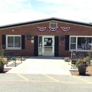 A welcoming entrance to a community building adorned with decorative bunting.