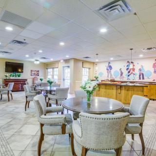 A spacious indoor dining area with modern decor and comfortable seating arrangements.