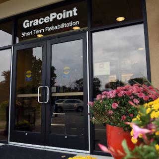 The entrance of GracePoint Short Term Rehabilitation, adorned with colorful flowers.