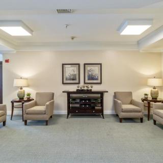A spacious and elegantly decorated lobby area featuring comfortable seating and stylish decor.