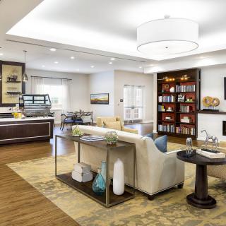 A modern living room with stylish furnishings and wooden flooring.