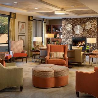 A modern living room with cozy seating and stylish decor.