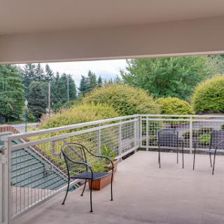 A peaceful balcony view surrounded by lush greenery, perfect for relaxing.