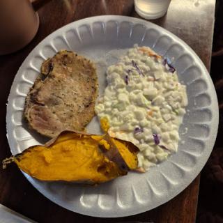 A hearty meal featuring meat, cottage cheese, and roasted squash.