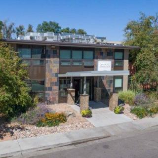 Modern commercial building with landscaped surroundings.