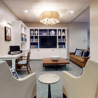 A modern living room with elegant furniture and stylish decor.