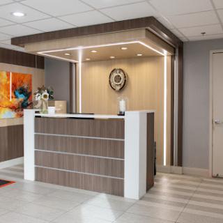 A modern reception area featuring stylish furniture and contemporary lighting.