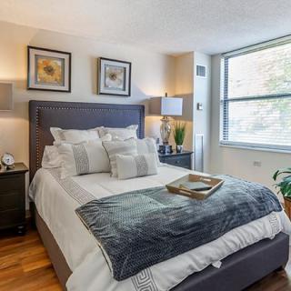 A cozy, well-decorated bedroom with a double bed and stylish decor.