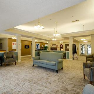 A spacious and well-lit lobby area with comfortable seating arrangements.