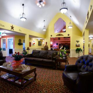 A warmly decorated lobby with comfortable seating and ambient lighting.