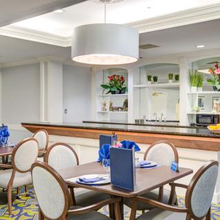 A modern dining room with elegant furniture and contemporary lighting.