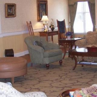 A cozy living room with comfortable seating and warm lighting.