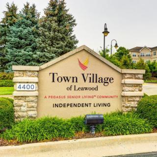 Entrance sign for Town Village of Leawood, a retirement community offering independent living.