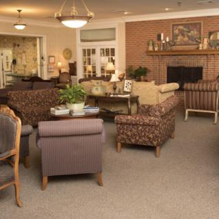 A cozy living room with comfortable seating and a fireplace.