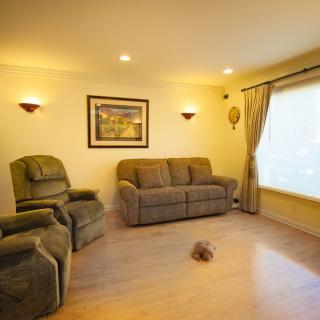 A cozy living room with comfortable seating and warm lighting.