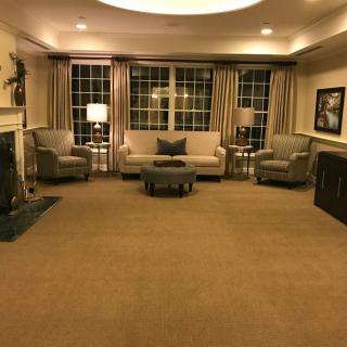 A cozy living room with comfortable seating and warm lighting.