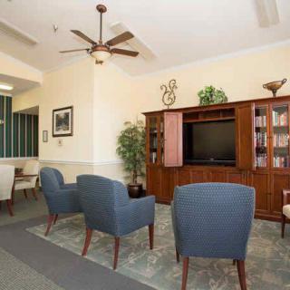 A cozy living room with comfortable seating, a television, and stylish decor.