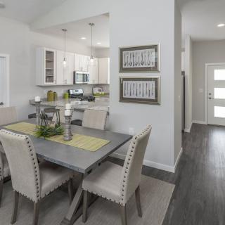 Modern open-plan dining and kitchen area with stylish decor.