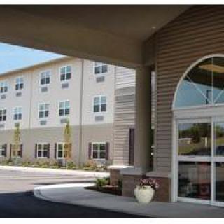 Front entrance of a modern building with large windows.