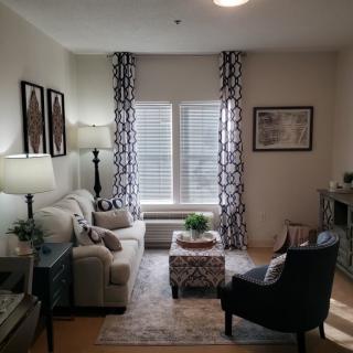 A cozy living room with stylish decor and natural light.
