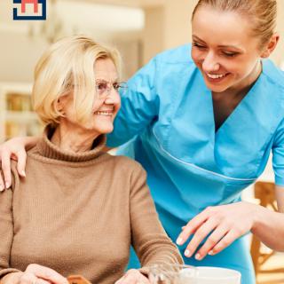 A nurse provides care and companionship to a senior woman.