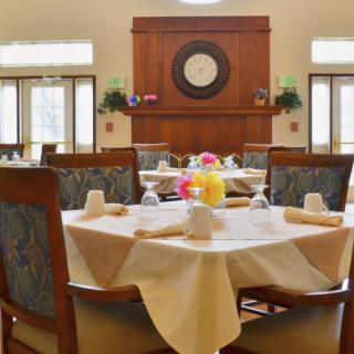 A beautifully set dining room with elegantly arranged tables and chairs.