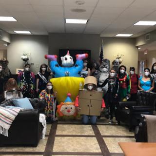 A lively gathering showcasing a variety of creative costumes and festive decorations.