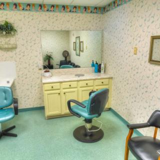 A vintage hair salon with retro decor and classic styling chairs.