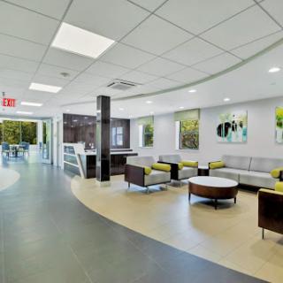 A modern waiting area featuring comfortable seating and a bright, inviting atmosphere.