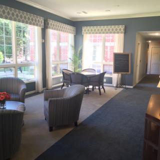A bright and inviting lobby area featuring comfortable seating and large windows.