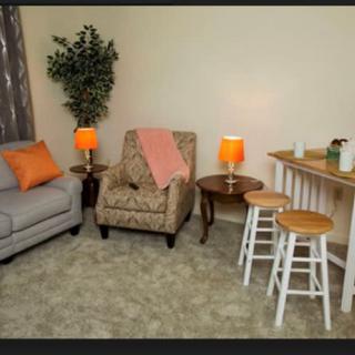 Cozy living room with comfortable seating and warm lighting.