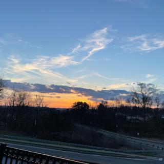 A serene sunset painting the sky with vibrant hues.