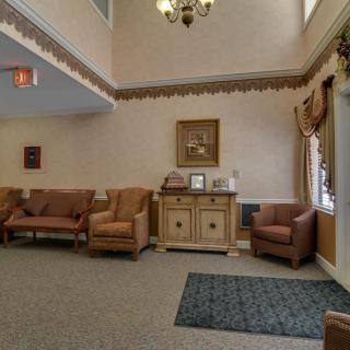 A cozy lobby area with comfortable seating and classic decor.