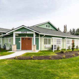 A suburban residential house with a well-maintained lawn.