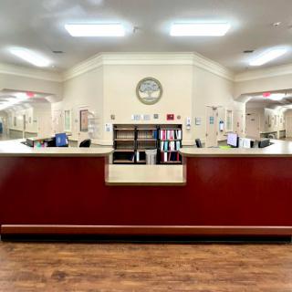 A spacious reception area with a large desk and welcoming environment.