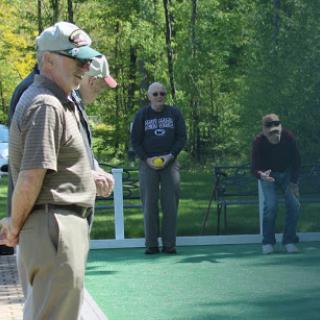 A group of individuals enjoying a leisurely game outdoors.