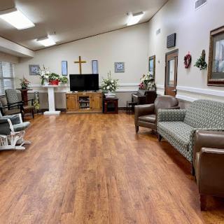A cozy and welcoming interior space with comfortable furniture, a television, and decorative elements.