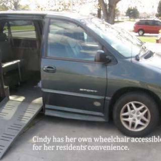 A wheelchair-accessible van with a ramp extended for easy access.