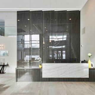 A modern lobby with a minimalist reception desk and contemporary design elements.