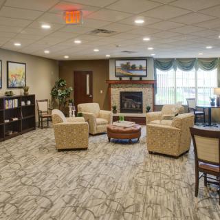 A cozy living room with comfortable seating and a fireplace.